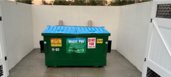 Same dumpster pad clean and refreshed after our work